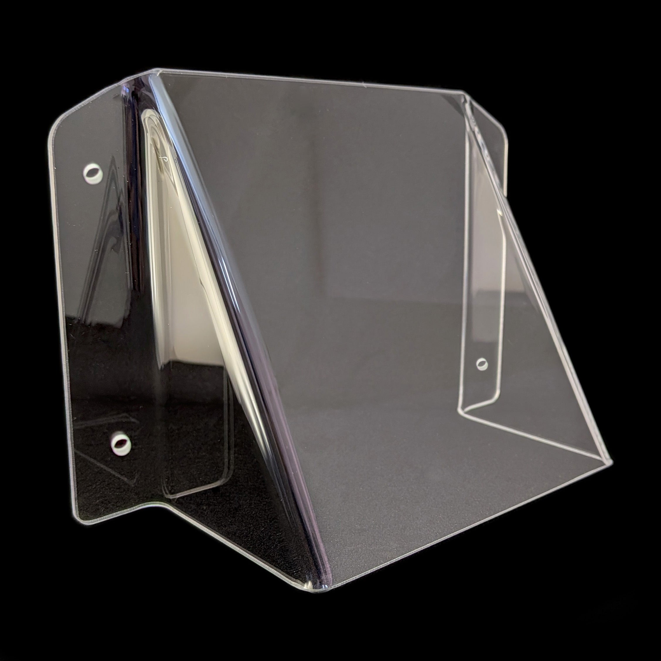 Clear acrylic power point cover with mounting holes, shown at an angle against a solid black background.